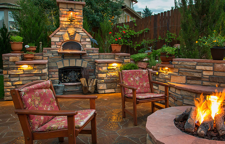 What are some safety tips for using an outdoor fireplace and pizza oven?